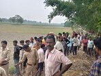 Forest officials and policemen at the spot in Dhaurahra range of the Dudhwa buffer zone after the leopard attack on Friday morning. (HT Photo)