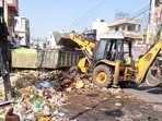 Karnal MC sanitary inspector Mandeep Singh said that garbage cleaning from major locations started as early as 5 pm on Thursday and continued till night. (HT Photo)