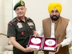 Lieutenant General Pushpendra Pal Singh felicitates Punjab chief minister Bhagwant Mann during a meeting in Chandigarh on Wednesday. (@westerncomd_IA X)