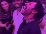 Trisha Krishnan and Sai Abhyankkar look on as RJ Balaji can't hold back emotions at Karuppu screening. 