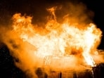 Flames and thick smoke rise from Robbins Lumber mill in Searsmont, Maine