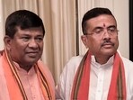 BJP first-time MLA from Cooch Behar Dakshin constituency Rathindra Bose (L) with West Bengal chief minister Suvendu Adhikari 