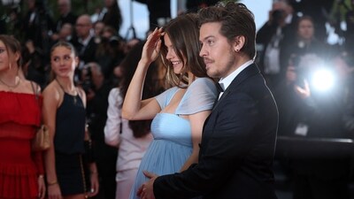 After weeks of speculation, the couple confirmed the pregnancy with a ‘bump reveal’ that stopped photographers in their tracks. (AFP)