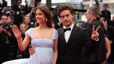 The joint post included a carousel: a professional Cannes shot, a playful ‘rock on’ gesture photo, and most touchingly, an ultrasound image. (AP)