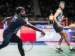 India’s Chirag Shetty (R) and Satwiksairaj Rankireddy play a point against Malaysia's Goh Sze Fei and Nur Izzudin in the doubles semi-final of the Thailand Open in Bangkok Saturday. (AFP)