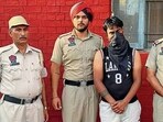 The accused in police custody on Saturday. (HT Photo)