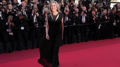 Andie MacDowell poses for photographers upon arrival at the premiere of the film Karma at the 79th International Film Festival in Cannes. She chose an all-black gown for the occasion.&nbsp; (AP Photo/Andreea Alexandru)
