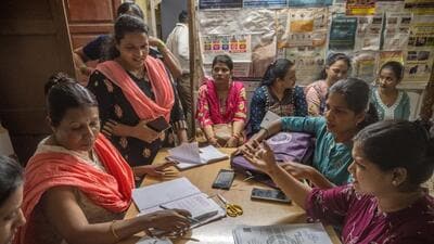 In Ramabai Ambedkar Nagar, teachers appointed for Census duty go through documents along with Asha workers on Saturday. (Satish Bate/Hindustan Times) In Ramabai Ambedkar Nagar, teachers appointed for Census duty go through documents along with Asha workers on Saturday. (Satish Bate/Hindustan Times)