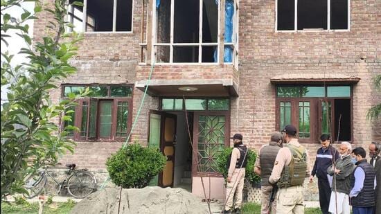 The Jammu and Kashmir Police raid on one of the 15 locations in Sopore district on Saturday. (HT Photo)