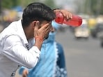 A man washes his face to beat the heat in Prayagraj on May 17. (HT photo)