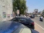 Illegally parked vehicles along the main road at Sadar Bazar cause traffic congestion near the Old MCG Office, as seen on Sunday. (Parveen Kumar/HT)