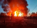 This photo released by Moscow Region Governor Andrei Vorobyev's official telegram channel shows a house on fire after a Ukrainian attack in Khimki, just outside Moscow, Russia. 