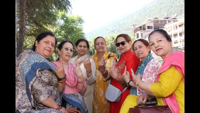 Women after casting their votes in Kullu on Sunday. (Aqil Khan /HT)
