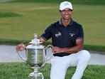 Aaron Rai poses with The Wanamaker Trophy after winning the 2026 PGA Championship at Aronimink Golf Club. (AFP)
