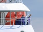 People in personal protective suits on board the cruise ship MV Hondius, which was affected by a hantavirus outbreak, after it arrived at the Port of Rotterdam, where Dutch authorities are preparing quarantine arrangements, in Rotterdam, Netherlands, May 18, 2026.