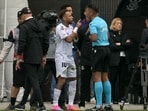 Neymar argues with the linesman during the Brazilian league football match between Santos and Coritiba.