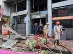 Fire personnel at a Vishal Mega Mart showroom, where a fire broke out on Friday, at Karol Bagh area, in New Delhi, Saturday, July 5, 2025.