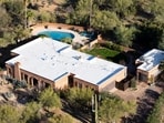 An aerial view shows the home of Nancy Guthrie, the missing mother of "Today" show host Savannah Guthrie, on Friday, March 6, 2026, in Tucson, Ariz. (AP Photo/Rebecca Noble)