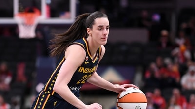 Caitlin Clark #22 of the Indiana Fever dribbles the ball upcourt against the Nigeria National Team (Getty Images via AFP) Caitlin Clark #22 of the Indiana Fever dribbles the ball upcourt against the Nigeria National Team (Getty Images via AFP)