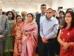 (Left) Chief Justice of India Surya Kant, Justice Dipankar Datta, Justice Vikram Nath and artist Jhuma Dutta. (HT)