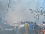 Charred remains of the vehicles after the fire. (Sunil Ghosh/HT Photo)