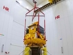Smile spacecraft (gold) fixed to a Vega-C rocket adaptor (black cone) in Kourou, French Guiana.