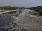 Large stretches of the dried Gomti riverbed reveal plastic waste, sludge and debris in Lucknow on Monday. (Deepak Gupta/HT)