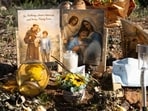 Religious cards left by a well-wisher are seen outside the home of Nancy Guthrie, the missing mother of "Today" show host Savannah Guthrie, in Tucson, Ariz., Friday, March 6, 2026. (AP Photo/Rebecca Noble)