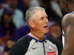 Draymond Green argues with NBA referee Scott Foster against the Phoenix Suns.