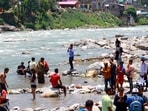 Tourists throng Manali to escape the summer heat, enjoying in the cool waters of the Beas River while the hill station buzzes with visitors and scenic mountain charm. (Aqil Khan /Hindustan Times) Tourists throng Manali to escape the summer heat, enjoying in the cool waters of the Beas River while the hill station buzzes with visitors and scenic mountain charm. (Aqil Khan /Hindustan Times)