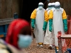 Health workers dressed in protective gear at an Ebola treatment center in Congo. Health workers dressed in protective gear at an Ebola treatment center in Congo.