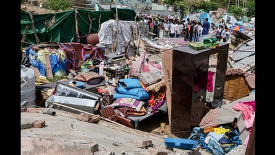 Household items lie scattered during an anti-encroachment drive carried out by the Forest Department and police to clear alleged illegal settlements on forest land, in Jammu, on Tuesday. (PTI) Household items lie scattered during an anti-encroachment drive carried out by the Forest Department and police to clear alleged illegal settlements on forest land, in Jammu, on Tuesday. (PTI)