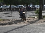 A motorcyclist crossed through an illegal cut at the Sector 68-80 dividing road in Mohali on Wednesday (Keshav Singh/HT)