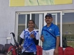 India’s teenage archer Kirti Sharma, who has qualified for the 2026 Asian Games in Japan, with her coach Udham Singh. (HT Photo)