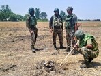 Security personnel recover and seize a consignment of around 2 kg of heroin suspected to have been dropped by a drone near the International Border in Jammu district, Wednesday. (PTI) Security personnel recover and seize a consignment of around 2 kg of heroin suspected to have been dropped by a drone near the International Border in Jammu district, Wednesday. (PTI)