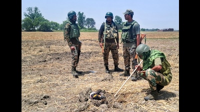 Security personnel recover and seize a consignment of around 2 kg of heroin suspected to have been dropped by a drone near the International Border in Jammu district, Wednesday. (PTI) Security personnel recover and seize a consignment of around 2 kg of heroin suspected to have been dropped by a drone near the International Border in Jammu district, Wednesday. (PTI)