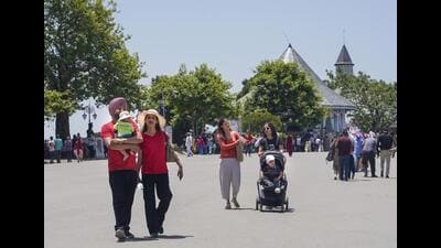Tourists taking a stroll on a hot summer day in Shimla on Wednesday. (PTI) Tourists taking a stroll on a hot summer day in Shimla on Wednesday. (PTI)