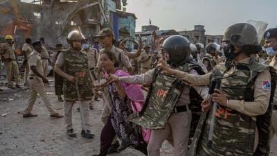 iiiMumbai, India - May 20, 2026: Residents of the ‘Garib Nagar’ slum in Bandra East allegedly pelt stones at police during the second day of an anti-encroachment drive on railway land, prompting a mild lathi-charge by police to control the situation in Mumbai, India, on Wednesday, May 20, 2026. (Photo by Satish Bate/ Hindustan Times) (Hindustan Times) iiiMumbai, India - May 20, 2026: Residents of the ‘Garib Nagar’ slum in Bandra East allegedly pelt stones at police during the second day of an anti-encroachment drive on railway land, prompting a mild lathi-charge by police to control the situation in Mumbai, India, on Wednesday, May 20, 2026. (Photo by Satish Bate/ Hindustan Times) (Hindustan Times)