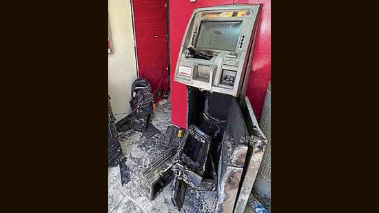 The damaged Axis Bank ATM at Nooranwala Road in Ludhiana on Wednesday. (Manish/HT)
