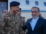 Pakistan's Army Chief Field Marshal Gen. Asim Munir, left, is welcomed by Iranian Foreign Minister Abbas Araghchi upon his arrival in Tehran, Wednesday, April 15, 2026. 
