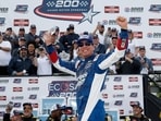 Kyle Busch, driver of the #7 HendrickCars.com Chevrolet, celebrates in victory lane after winning the NASCAR Craftsman Truck Series