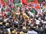 Congress workers take out a protest march towards the BJP Rajasthan headquarters against the alleged irregularities in the NEET-UG medical entrance exam, in Jaipur, Thursday, May 21, 2026.