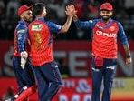 Punjab Kings' captain Shreyas Iyer (R) celebrates with teammates during the match against Mumbai Indians. (AFP)