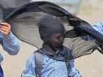 Student seen covering head and face with cloth to protect from heat wave on a hot summer day at Sector-11 in Gurugram (HT PHOTO/Parveen Kumar) Student seen covering head and face with cloth to protect from heat wave on a hot summer day at Sector-11 in Gurugram (HT PHOTO/Parveen Kumar)
