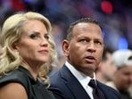 Minnesota Timberwolves controlling owner and former Major League Baseball player, Alex Rodriguez, watches the Timberwolves play the Detroit Pistons with his girlfriend Jaclyn Cordeiro, in the first half of an NBA basketball game Thursday, April 2, 2026, in Detroit. 