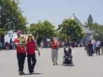 Tourists taking a stroll on a hot summer day in Shimla on Wednesday. (PTI) Tourists taking a stroll on a hot summer day in Shimla on Wednesday. (PTI)
