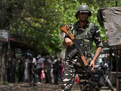 ভোট মিটলেও রাজ্যে থাকছে কেন্দ্রীয় বাহিনী (ছবিটি প্রতীকী, সৌজন্যে এএফপি)