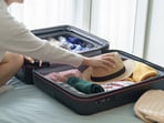 A sleek hard-shell trolley set packed for an overseas holiday brings convenience, storage, and stress-free airport movement. (Canva.com)