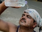 Bhubaneswar: A man pours water on his face to beat the heat on a hot summer day on Friday.
