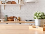Simple countertop additions and pretty storage pieces can make your kitchen feel cleaner, brighter, organised, and instantly more inviting daily. (Canva.com)